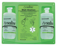 Two bottle Honeywell eyewash station with a green backer/mounting board w/ usage instructions and two 32 ounce bottles of Eyesaline® mounted on it.