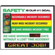A photograph of a red, yellow, and green 06351 safety is our #1 goal stoplight electronic signal scoreboard.