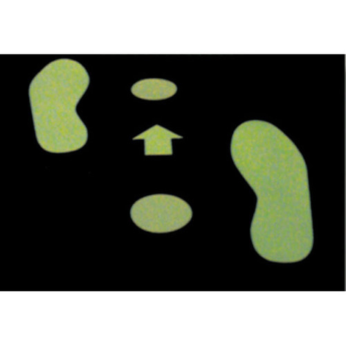 A photograph of a pair of 06439 glow in the dark polyester footprints in use on floor in a facility in the dark.