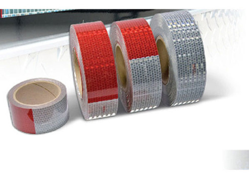 Photograph of 4 rolls of Conspicuity DOT-C2 Reflective Tape.