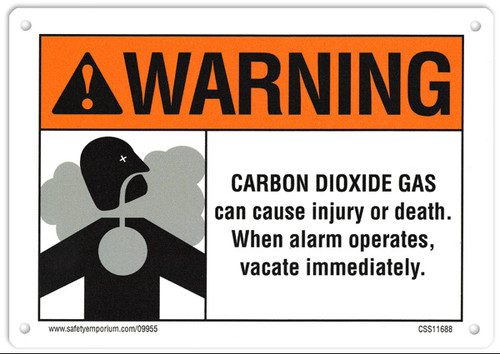 A photograph of a 09955 CO2 system sign, reading warning - carbon dioxide gas can cause injury or death, when alarm operates, vacate immediately, with graphic.