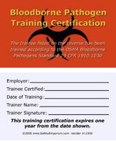 A photograph of front and back of an orange 11500 bloodborne pathogen training certification card.