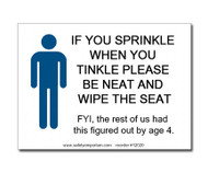 A photograph of a 12020 witty workplace label reading if you sprinkle when you tinkle please be neat and wipe the seat, with graphic.