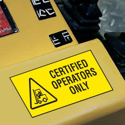 A photograph of a yellow 12202 forklift label, reading certified operators only with graphic,  and 5 per package.