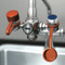 A photograph of a set of Guardian 250-046R Dust Caps For Faucet-Mounted Eyewash Stations installed on a G1100 faucet-mounted eyewash with one shown in place and the other in the in use position.