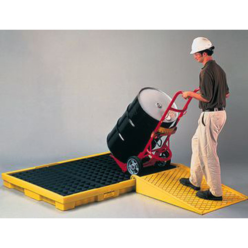 A photograph of a 04314 poly ramp for low-profile modular spill platform and pallets in use.