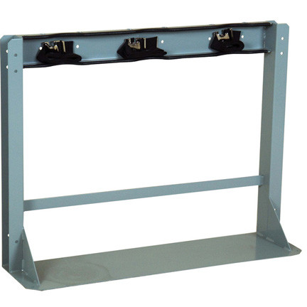 A photograph of a 26013 3 gas cylinder floor-mounted storage stand with straps.
