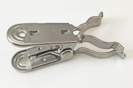 A photograph of front of a 24001 stainless steel standard taper joint clip, with 10 per package.