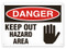 A photograph of a 01636 danger, keep out hazard area OSHA sign with hand graphic.