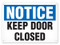 A photograph of a 01650 notice keep door closed OSHA sign.