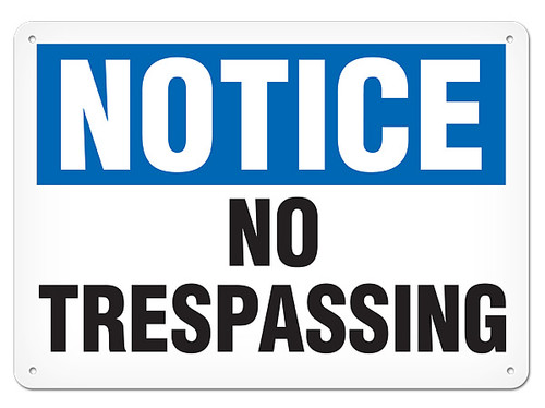 A photograph of a 01653 notice no trespassing OSHA sign.
