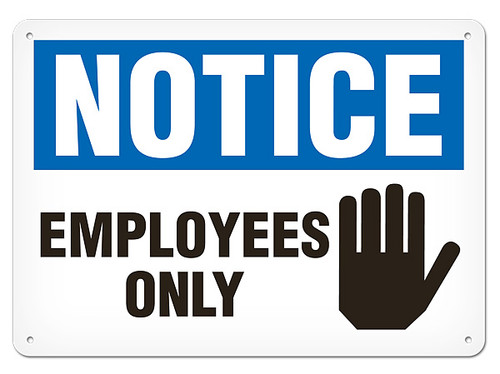 A photograph of a 01656 notice employees only OSHA sign with hand icon.