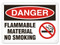 A photograph of a 01562 danger, flammable material no smoking OSHA sign with no smoking icon.