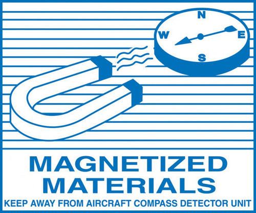 A photograph of a blue and white 12334 hazardous material shipping label, reading magnetized materials with illustration.