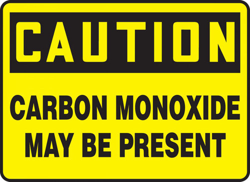 A photograph of a yellow and black 01751 caution carbon monoxide may be present OSHA sign.