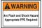 A photograph of an orange and white 07325 ANSI warning arc flash labels and sign, with basic text.