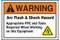 A photograph of an orange and white 07337 ANSI warning arc flash label with arc flash icon.