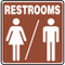 A photograph of a brown and white 03468 restrooms sign with graphic, and dimensions 10" w x 10" h.