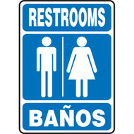 A photograph of a blue and white 03472 bilingual english/spanish restroom sign with graphic, reading restrooms/banos.
