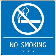 A photograph of a white on blue 03506 ADA braille tactile sign, reading no smoking with cigarette prohibition graphic.