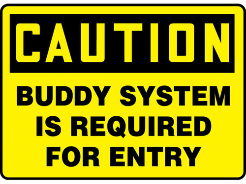 A photograph of a yellow and black 01700 caution buddy system is required for entry OSHA sign.