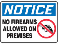 A photograph of a blue and white 01662 notice no firearms allowed on premises OSHA sign with handgun icon.