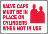 A drawing of a white sign with red text of "Valve Caps Must Be In Place On Cylinders When Not In Use" along with red icon of two capped cylinders.