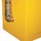 A closeup of a damper installer on a yellow flammable storage cabinet.