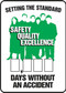 A photograph of a 06311 setting the standard: safety, quality, excellence __ days without an accident write-a-day dry erase safety scoreboards.