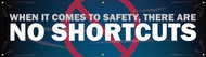 Picture of Workplace Safety Banner that features a dark blue and black patterned background, the image of a red "no" symbol in the background and wording "When It Comes To Safety, There Are No Shortcuts" in bold white text. 