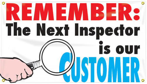 Picture of Workplace Safety Banner that features a clean white background. In the bottom left is a hand holding a magnifying glass up to the text on the banner. Along the top of banner in bold eye-catching red it reads "Remember:", continued below in bold black text it reads "The next inspector is our", and finished off in cool blue text it reads "Customer". The text combined reads out "Remember: the next inspector is our customer"