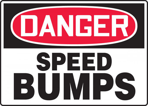 A photograph of a black and white 06255 OSHA sign, reading danger speed bumps.