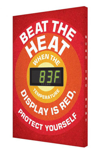 A photograph of a red 11051 electronic heat stress sign, reading beat the heat - when the temperature display is red, protect yourself, with green Fahrenheit temperature reading.