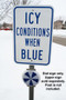 A photograph of a 11072 Icealert™ temperature indicator sign installed outside in cold climate below icy conditions when blue sign (sold separately).
