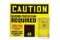 A front photograph of a yellow and black 11103 OSHA caution decibel meter sign, with 20" l x 24" w dimensions, and ear plug hopper dispenser.