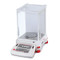 Photograph of Ohaus Explorer® Analytical Balance, left facing, demonstrating certified readability to 1 mg.