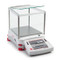 Photograph of Ohaus Explorer® Precision Balance with optional draft shield, right facing.