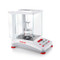 Photograph of Ohaus Adventurer® Analytical Balance with draft shield  open, side view, with optional density kit.