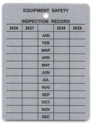 Metal tag with EQUIPMENT SAFETY INSPECTION RECORD header and grid with 2026 through 2029 for monthly punching/marking.