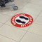 A picture of this sign installed on a grocery store floor.
