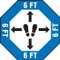 A photograph of a blue and white 11233 social distance floor sign, reading 6 ft, in an octagon, wit footprints icon and directional arrows.