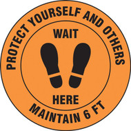 A photograph of an orange and black 11238 social distance floor sign, reading protect yourself and others maintain 6 ft wait here, with footprints icon.