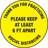 A photograph of a yellow and black 11239 social distance floor sign, reading thank you for practicing social distancing please keep at least 6 ft apart.