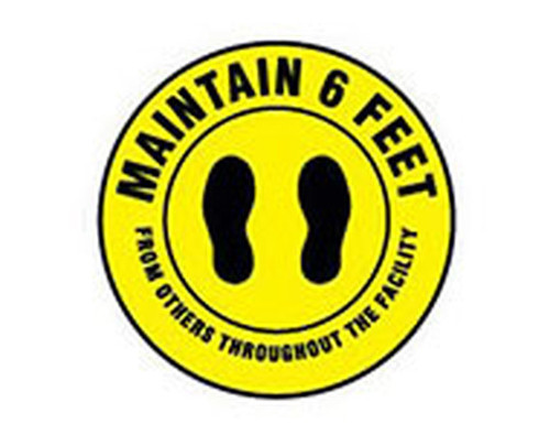 A photograph of a yellow and black 05403 removable social distance floor sign, reading maintain 6 feet from others throughout the facility, with footprints graphics.