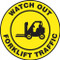 A photograph of a yellow and black 11253 pavement print sign, reading watch out forklift traffic, with forklift graphic.