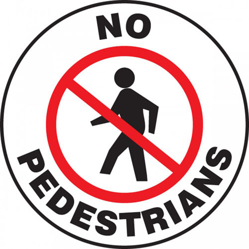 A photograph of a white and black 11256 pavement print sign, reading no pedestrians, with person walking graphic.