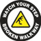 This black and white sign features a yellow caution sign in the center with the image of a figure tripping over an obstacle. White text on a black border reads "Watch Your Step, Broken Walkway". Use for areas with broken and dangerous walkways.