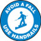 This blue and white sign features the text "Avoid A Fall Use Handrails" along a blue border. In the center, there is the image of person using a handrail while going down a staircase. Use to help prevent slips and falls on stairs.