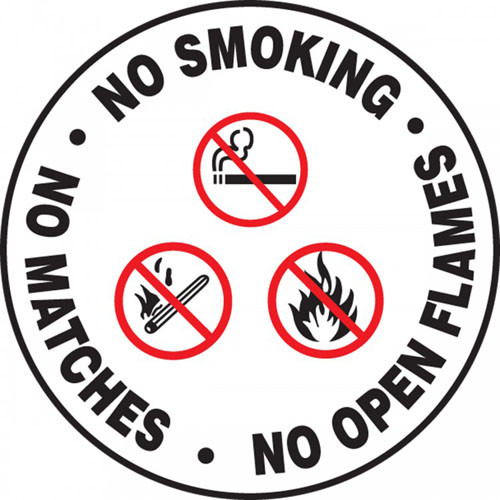 This white, black, and red sign has three statements on it, "No Smoking", "No Matches", and "No Open Flames". The center has a matching graphics of a cigarette, match, and fire, each with cross through them. Use to prevent any form of uncontrolled flame.

