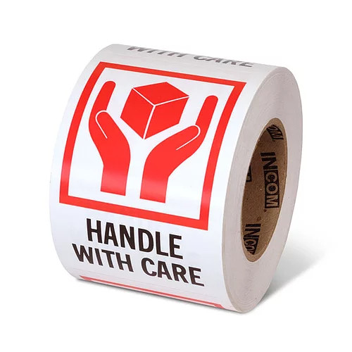 Photograph of a roll of Speciality Handling Labels, "Handle With Care" with Graphic.